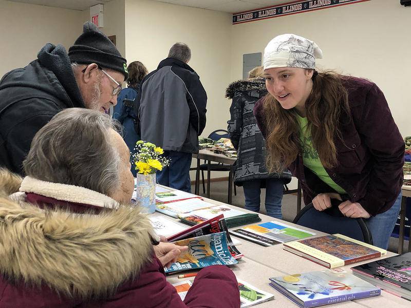Master Gardener Natalie Kollmann (right) speaks with home gardeners Bob Keenan and Nancy Keenan during the seed swap Feb. 2 in Yorkville. Along with seeds, Master Gardeners were on hand to field questions.