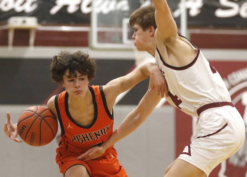 McHenry's Marko Stojich tries to drive on Antioch’s Joel Bulka during a nonconference basketball game Thursday, Jan. 4. 2024, at Antioch High School.