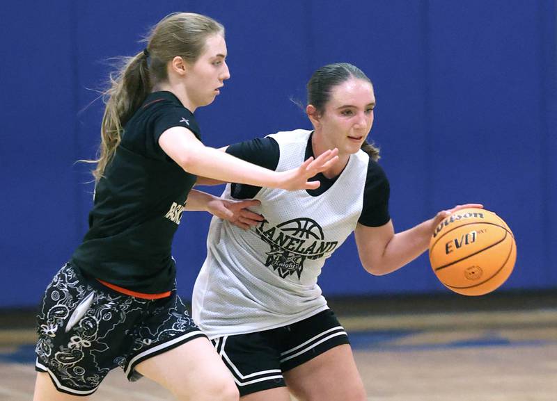 Kaneland’s Kyra Lilly is guarded by DeKalb’s Olivia Schermerhorn Thursday, June 12, 2025, in the Geneva High School Varsity Summer League.
