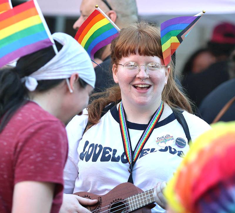 Alex Dawe has a laugh with friends Thursday, June 23, 2022, during an event to celebrate Pride month in DeKalb. The function included a short parade through downtown and a showing of the movie “Tangerine,” with a panel discussion afterwards at the Egyptian Theatre.