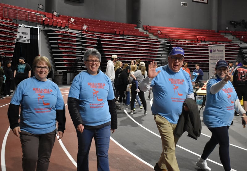 Participants walk during Safe Passage's annual Walk A Mile in Their Shoes event on April 18, 2026, at the Northern Illinois University Convocation Center in DeKalb. The event, held to raise awareness of sexual violence and supoprt survivors, was hosted by the nonprofit as part of Sexual Assault Awareness Month.