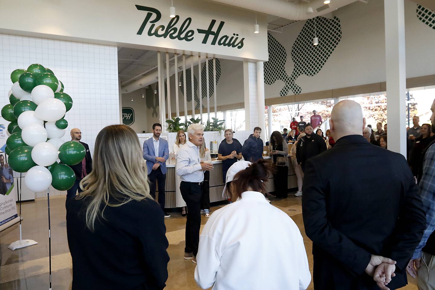 John McLinden welcomes people during a grand opening ceremony for the Pickle Haus in Algonquin, on Friday, Nov. 10, 2023. The Pickle Haus offers indoor pickle ball courts, food and drinks.
