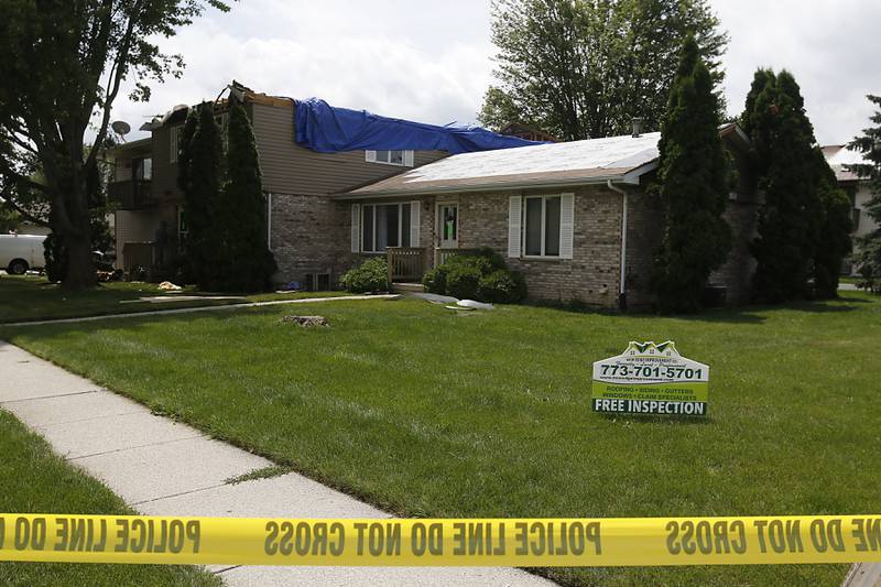 A damaged apartment building in Huntley on Thursday, July 13, 2023, after a possible tornado took the roof off the building in Huntley on Wednesday.