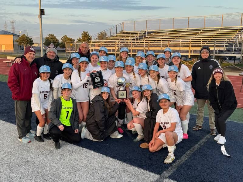 The Lockport girls soccer team poses with its freshly won Windy City Classic championship trophy claimed Thursday, March 21, 2024, in Burbank.