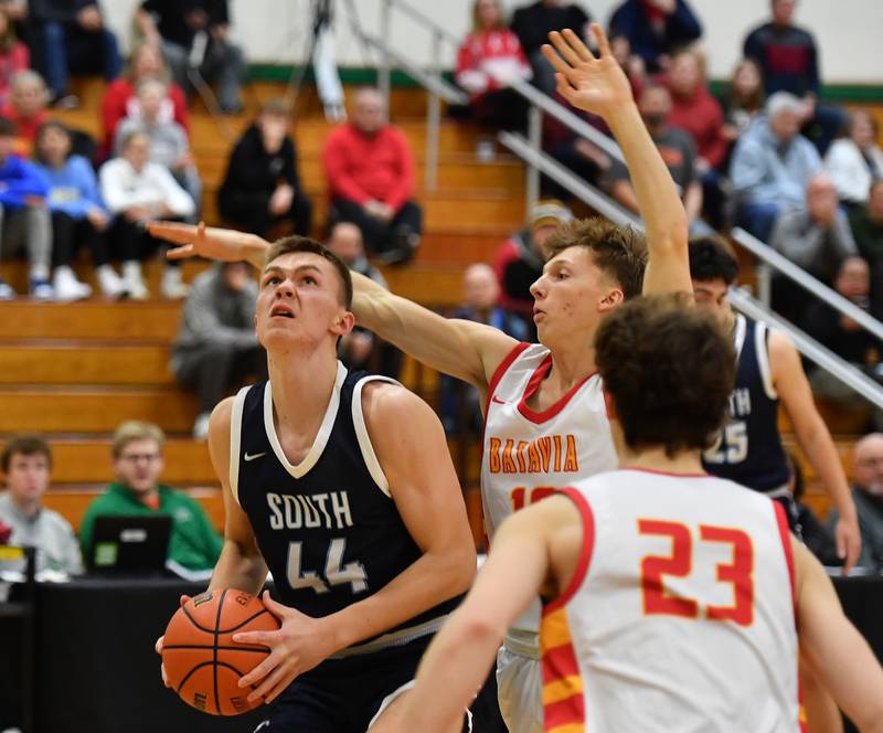 Downers Grove South's Justin Sveiteris (44) looks to shoot while Batavia's Nate Nazos defends during a Jack Tosh Classic game in December at York High School in Elmhurst.