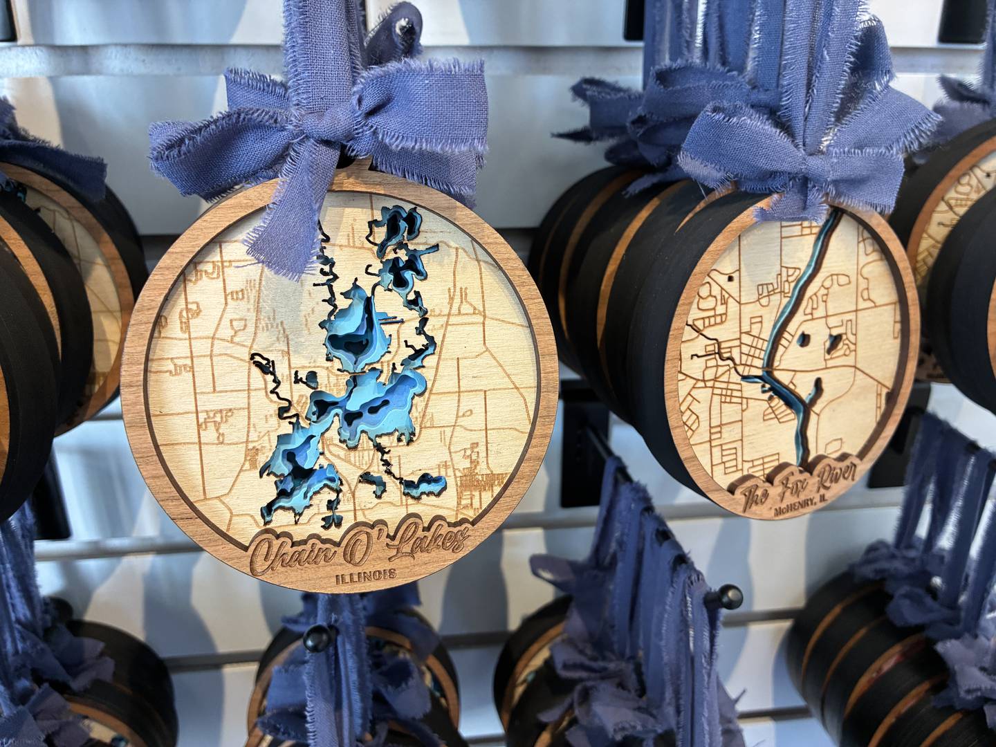 Ornaments at Roots & Routes map out the Chain O' Lakes – showing them inside their banks - on Sunday, April 26, 2026, at the McHenry Riverwalk Shoppes.
