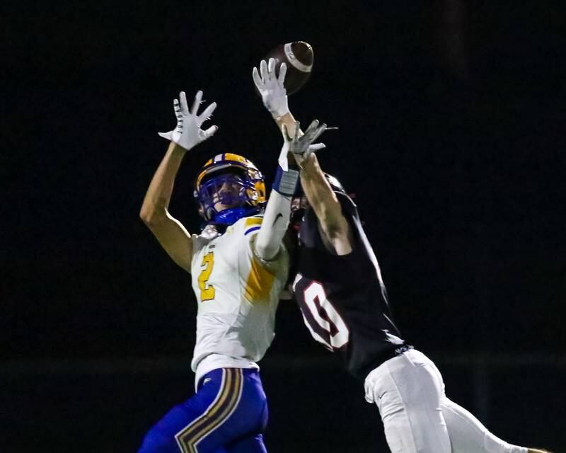 Lincoln Way Central's Blake Richards (10) breaks up a pass intended for Sandburg's Sean Weisberger (2) during football game between Sandburg at Lincoln Way Central.  Sept 22, 2023.