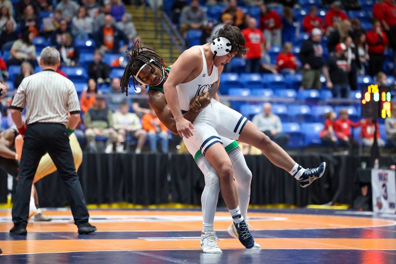 Providence Catholic's Jasper Harper takes down IC Catholic's Jacob Alvarez in the 165-pound match during IC Catholic's victory in the IHSA Class 2A Dual Team State championship on Saturday, Feb. 28, 2026.