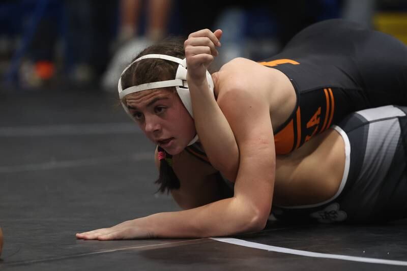 Minooka’s Addison Cailteux looks to the referee for the fall call against Joliet Township’s Alexandra Rosas in the Southwest Prairie Conference 130 pound Championship at Joliet Central on Saturday, Jan. 20th, 2024.