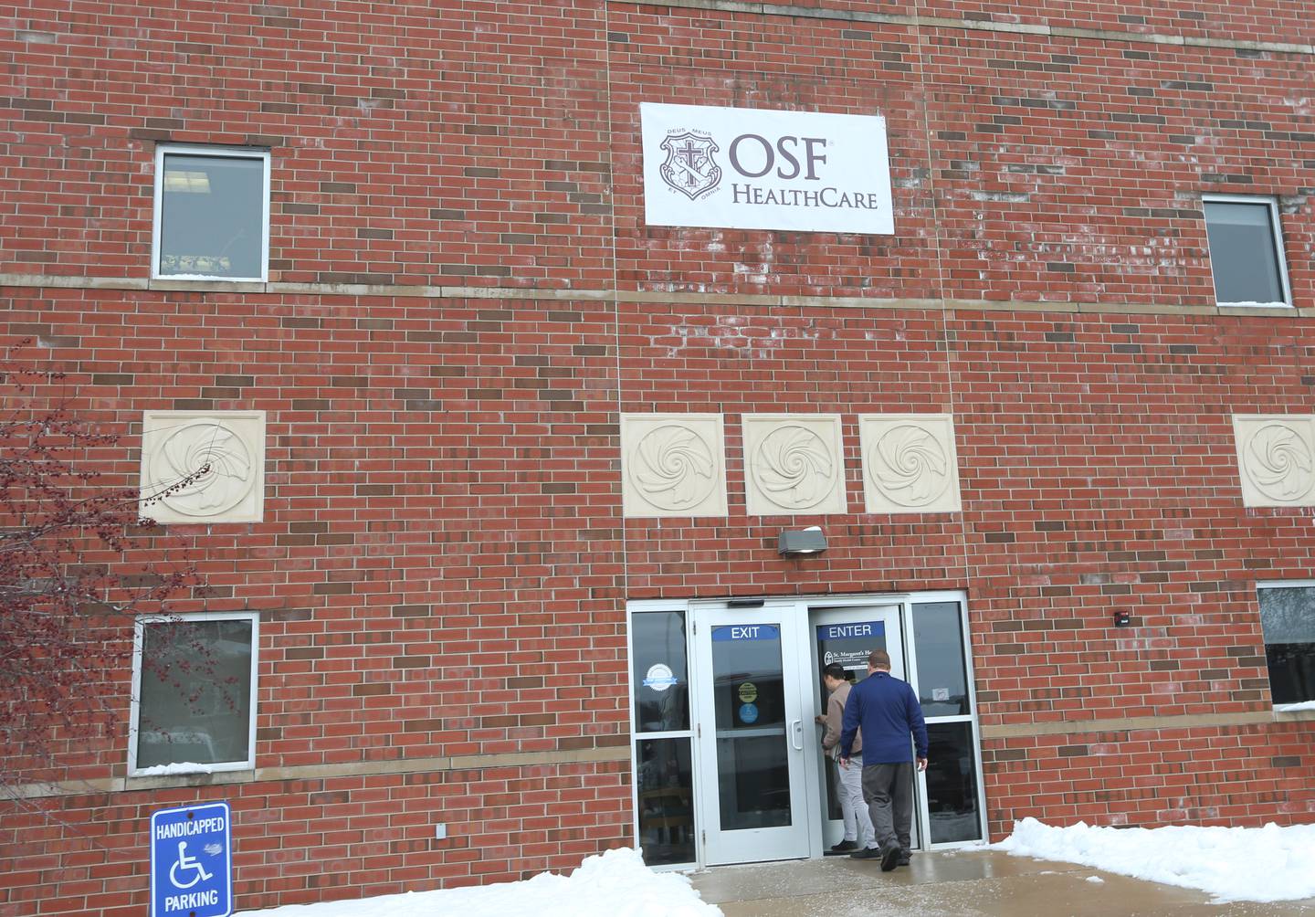 Employees walk into the new OSF Healthcare clinic on Wednesday, Jan. 10, 2024 in Spring Valley. The clinic is located across from the former St. Margaret's Hospital at the intersection of East First and Mary Streets in Spring Valley.
