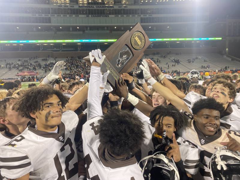 Mount Carmel celebrates winning the Class 7A state championship against Batavia on Saturday in Champaign.