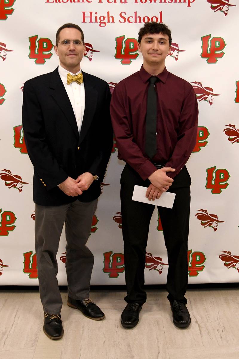 Nathaniel Hansen (right) received the $1,000 Esther Styma Scholarship, which is awarded to a student with a GPA of at least 3.0 who is a resident of La Salle and submits an essay on the topic, "How education will make a difference in my life." The scholarship was presented by Philip Slevin of Hometown National Bank.