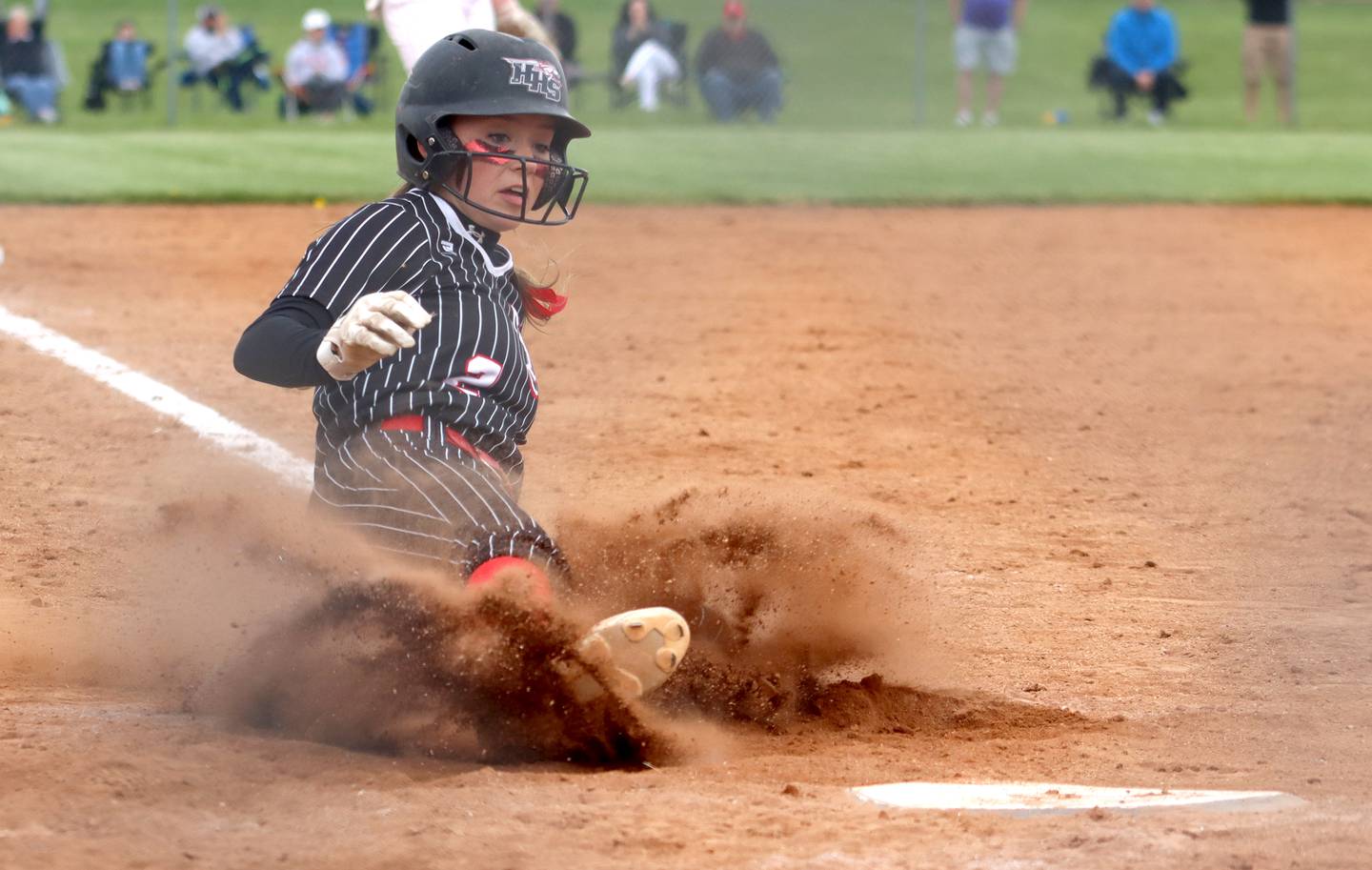 Huntley’s Reese Hunkins plates a run early on against Barrington during the Class 4A Huntley Sectional championship, Saturday, June 4, 2022.