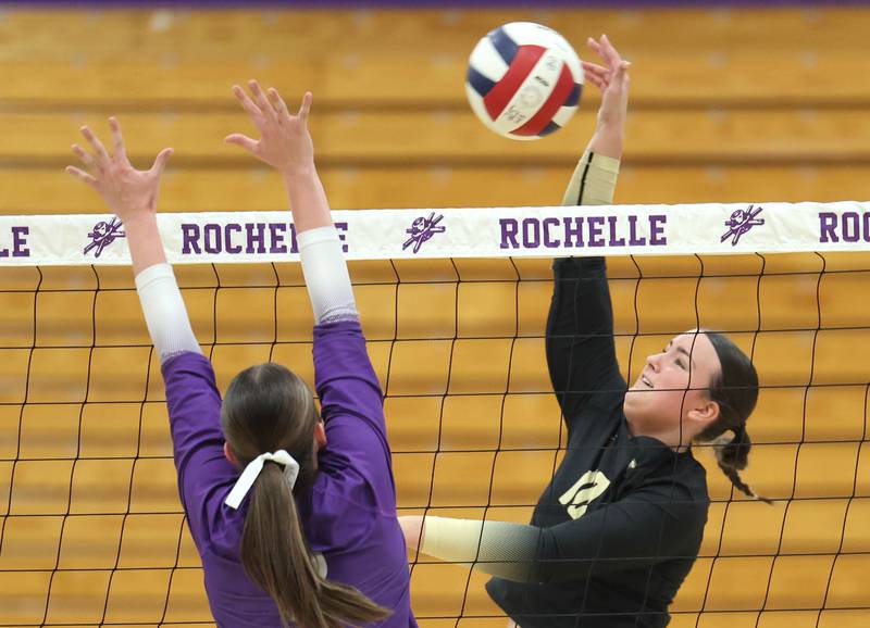 Sycamore's Sophia Lichthardt tries to get the ball by Rochelle's Audyn Kemp Tuesday, Oct. 28, 2025, during their Class 3A regional semifinal match at Rochelle High School.