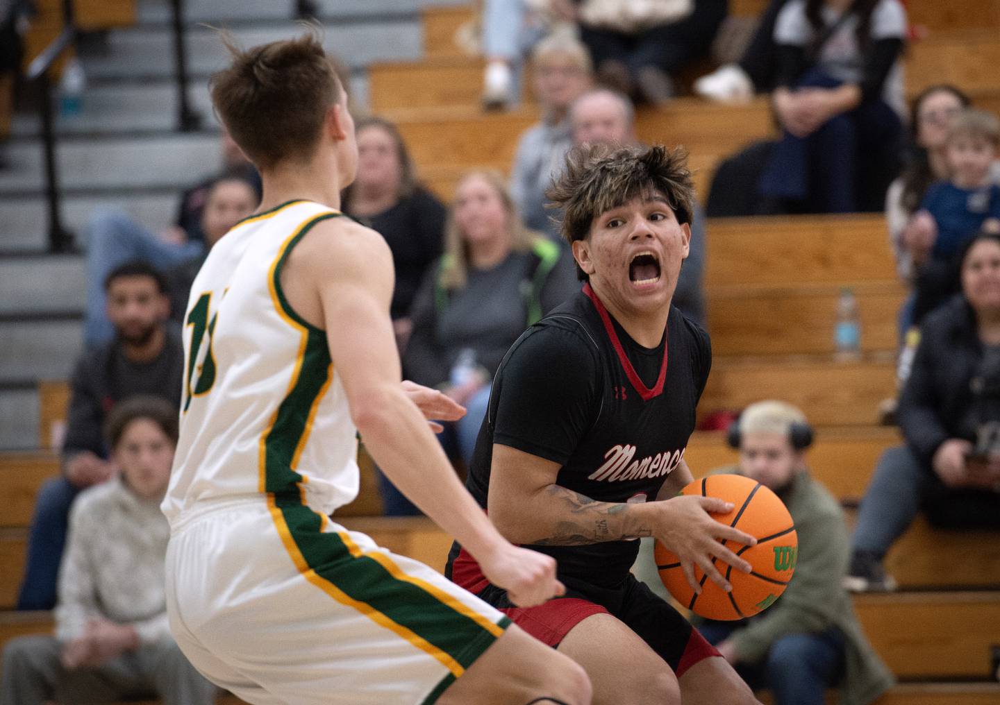 Momence's Erick Castillo, right, makes a break toward the net as Grant Park's Ian Hamann guards in a game on Friday, January 16, 2026.