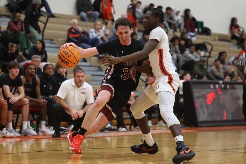 Plainfield North’s Quintin Wiencek makes a move to the baseline against Plainfield East on Tuesday, Jan 14, 2025.