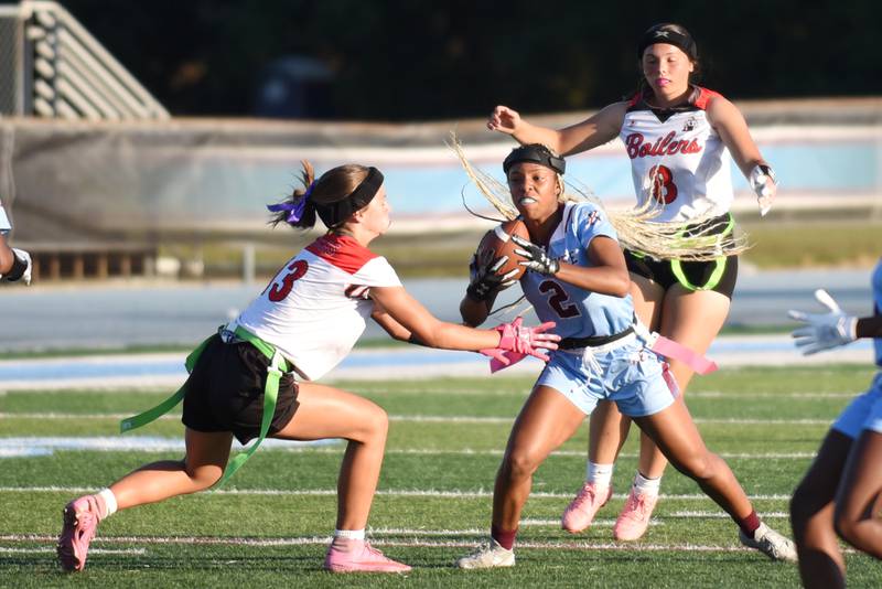 Kankakee's Damariana Tooles (2) looks to evade Bradley-Bourbonnais' Sophia Darling during the All-City game at Kankakee Wednesday, Sept. 17, 2025.