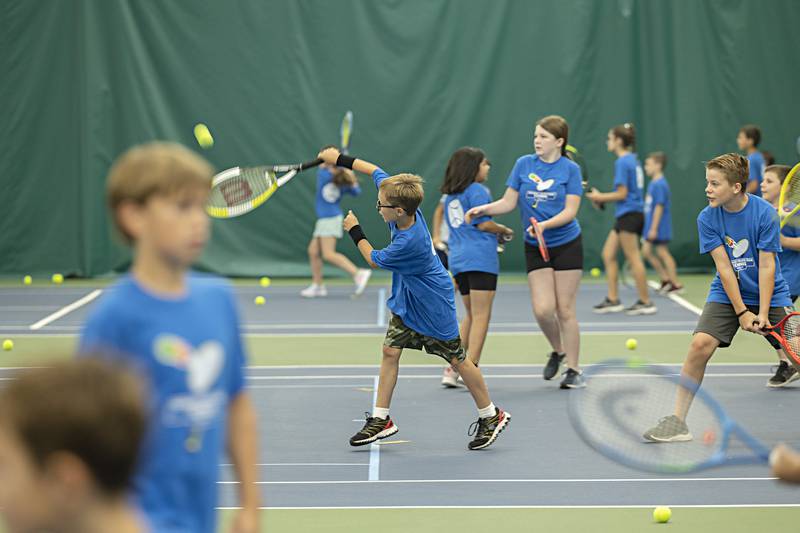 The groups were divided onto four courts Thursday, June 29, 2023 as they competed against one another for quality tennis shots.