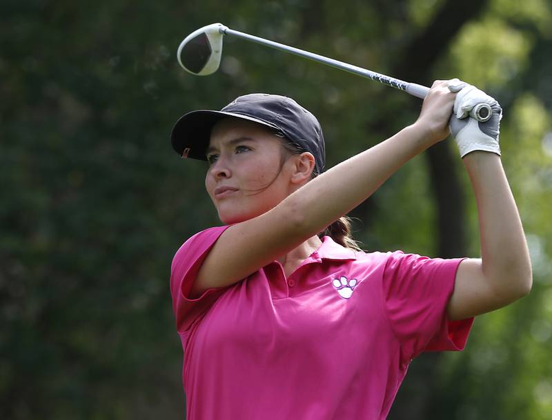 Hampsire’s Lily Farnam watches her tee shot on the ninth hole during the Fox Valley Conference Girls Golf Tournament Wednesday, Sept. 21, 2022, at Crystal Woods Golf Club in Woodstock.