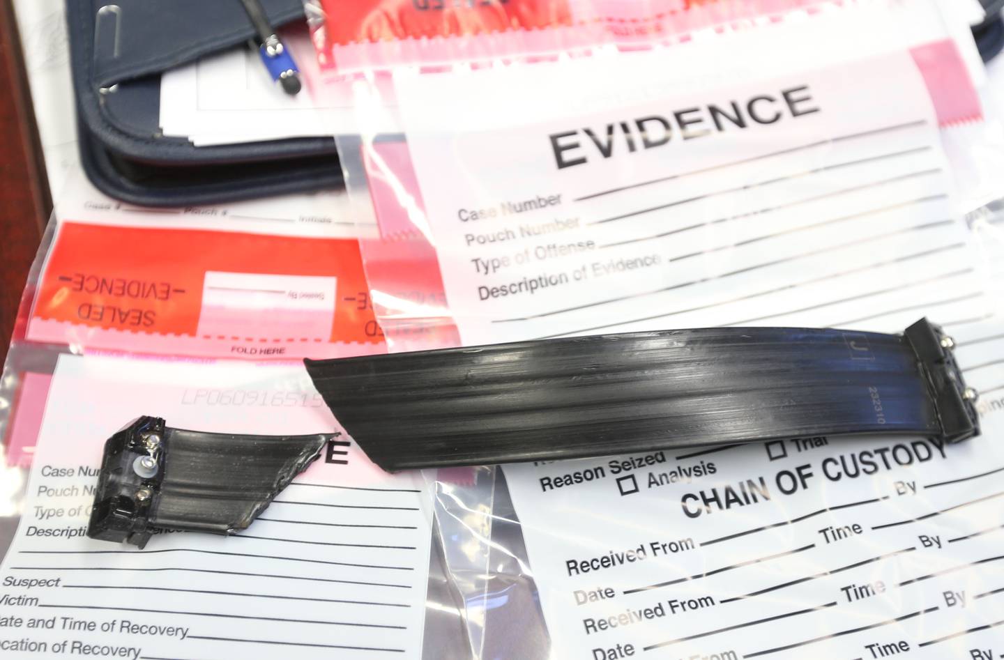 A cut ankle monitor bracelet is placed in a evidence bag on Wednesday, Nov. 27, 2024, at the Ottawa Police Station. Felony suspects are disabling or cutting in open defiance of the terms of pre-trial release. About 1 in 5 felony suspects in La Salle County placed on GPS monitoring has disabled, tampered with or simply cut off their ankle bracelets.