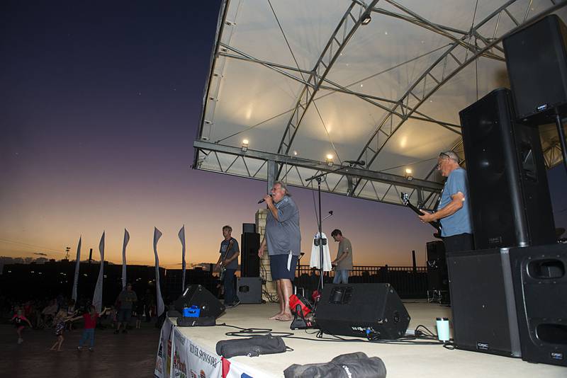 Local band Problem Child fires up the crowd from the stage at RB&W Park in Rock Falls before the Jaycees fireworks show Friday, July 1, 2022.