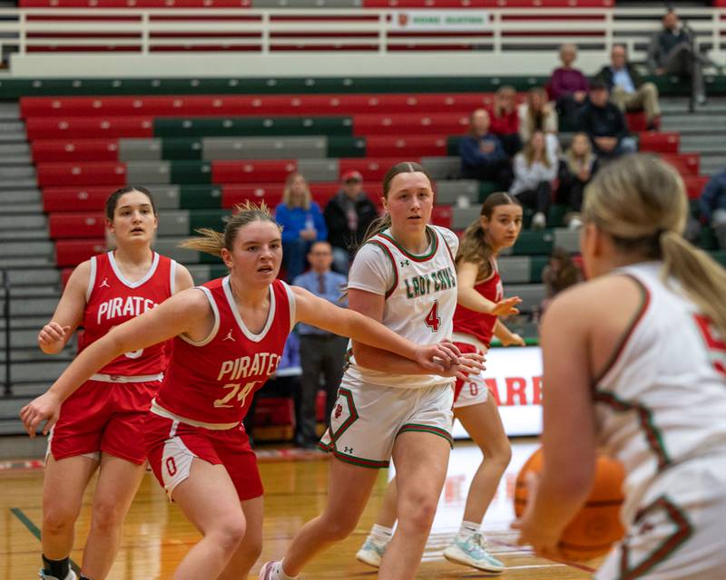 Kennedy Kane (24) of Ottawa runs to close out Emma Jereb (5) of LaSalle-Peru as she looks to shoot 3-pointer on Wednesday, December 17, 2025 at Sellet Gymnasium in LaSalle.