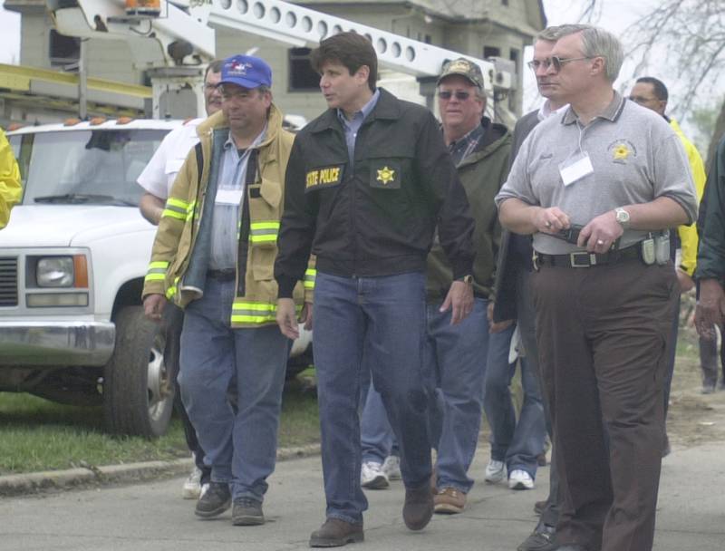 Former Utica Fire Chief Dave Edgcomb, former Utica mayor Fred Esmond, former La Salle County Sheriff Tom Templeton walk with former Illinois governor Rod Blagojevich as he tours the devastation in 2004 downtown Utica.