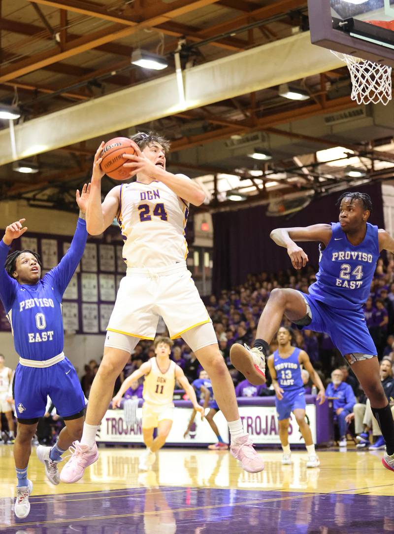 DGN's George Wolkow (24) grabs a rebound during the boys 4A varsity regional final between Downers Grove North and Proviso East in Downers Groves on Friday, Feb. 24, 2023.