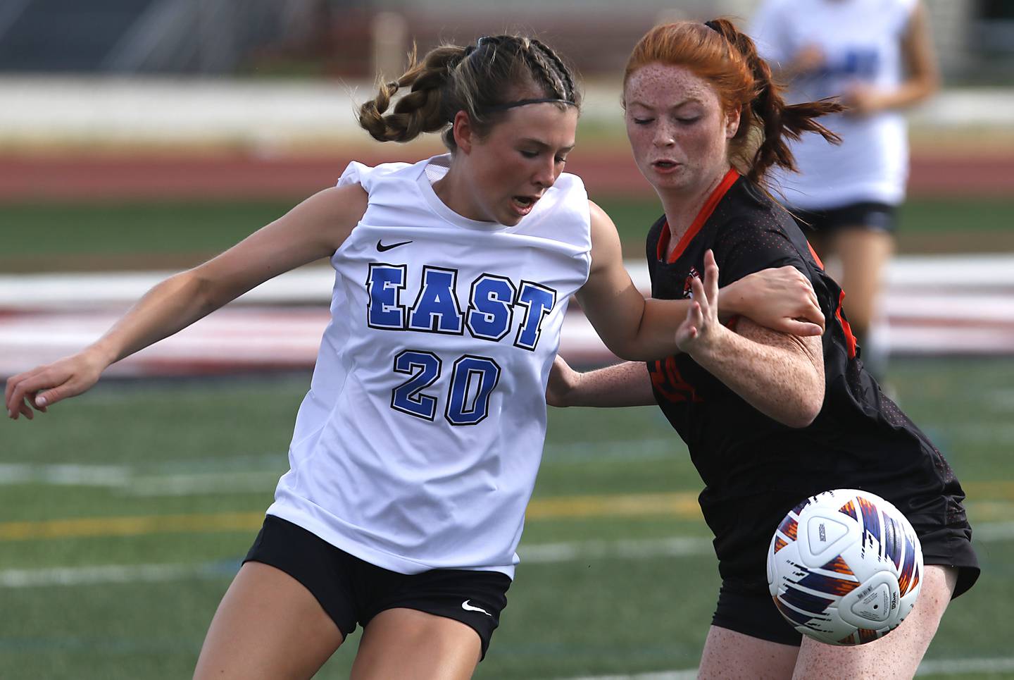 Lincoln-Way East's Breanna Herlihy tries to chase down the ball in front of Libertyville’s Ellie Rebman during the IHSA Class 3A state third-place match at North Central College in Naperville on Saturday, June 3, 2023.