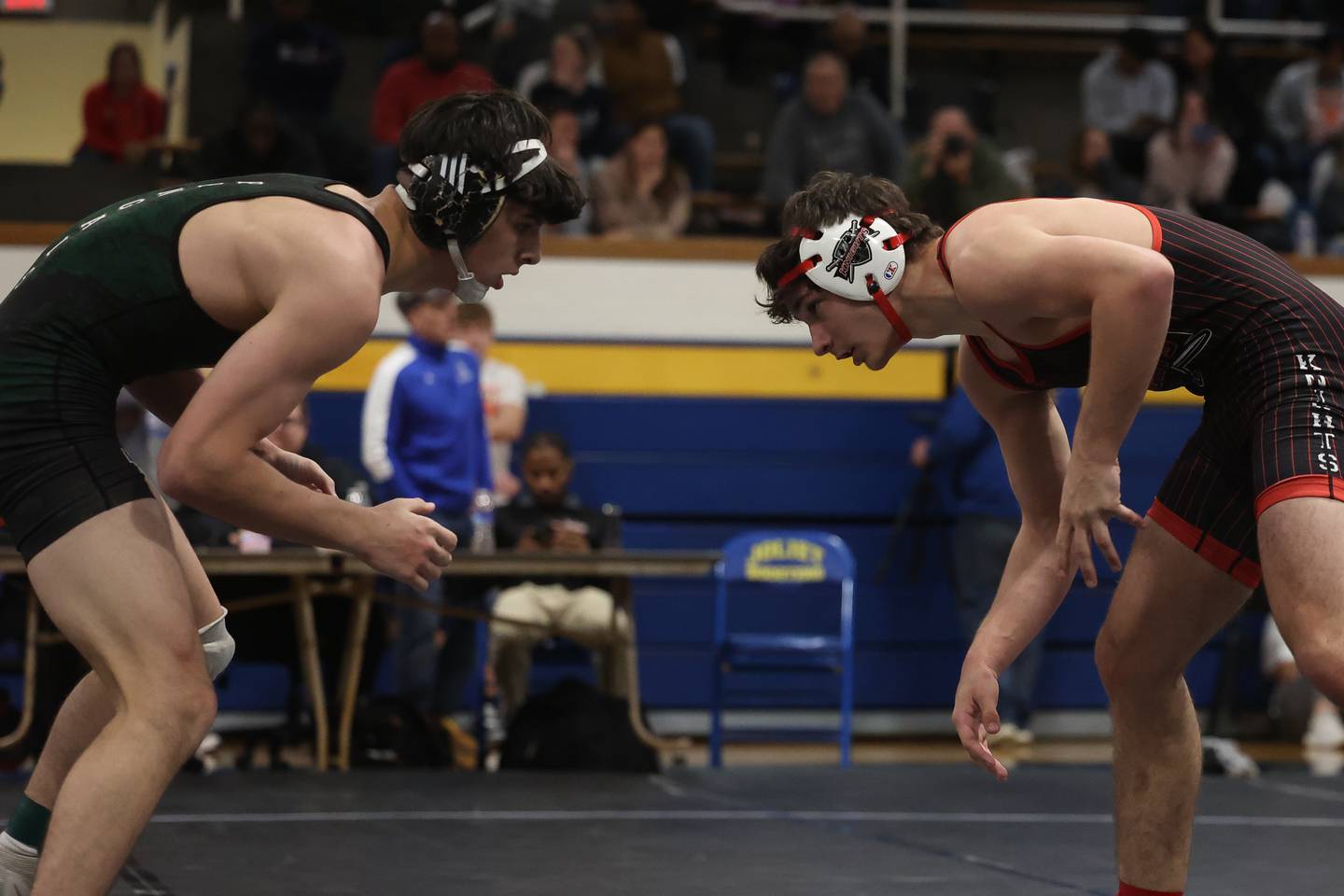 Plainfield East’s Niko Duggan faces off with Lincoln-Way Central’s Caden Harvey in the Joliet Central McLaughlin Classic on Saturday, Dec. 2, 2023 in Joliet.