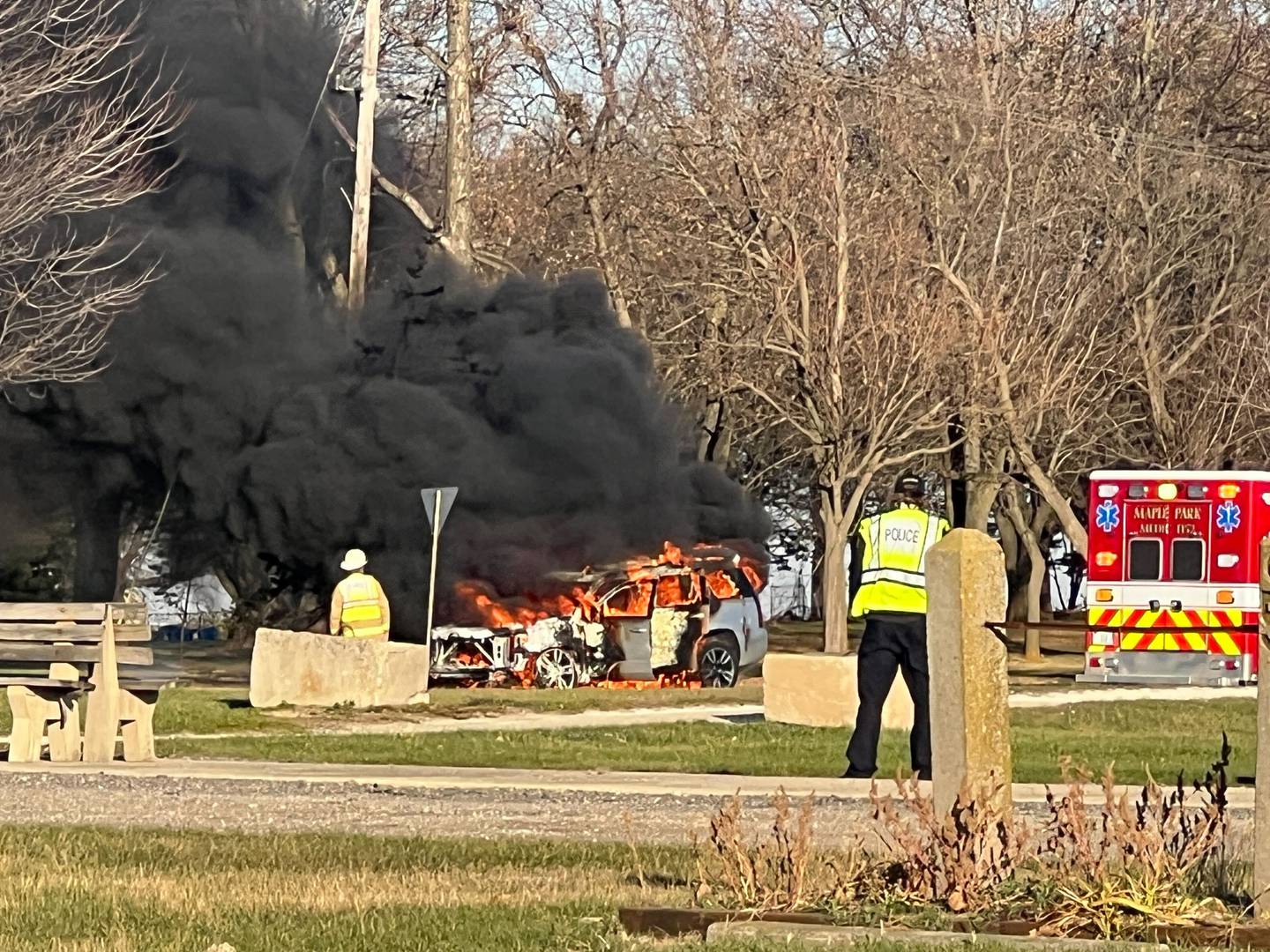 Plumes of black smoke rises through the air on Friday, Nov. 14, 2025, from a car fire near the parking lot of Sycamore Speedway. Authorities from the Kane County Sheriff's Office and Maple Park police were among those who responded.