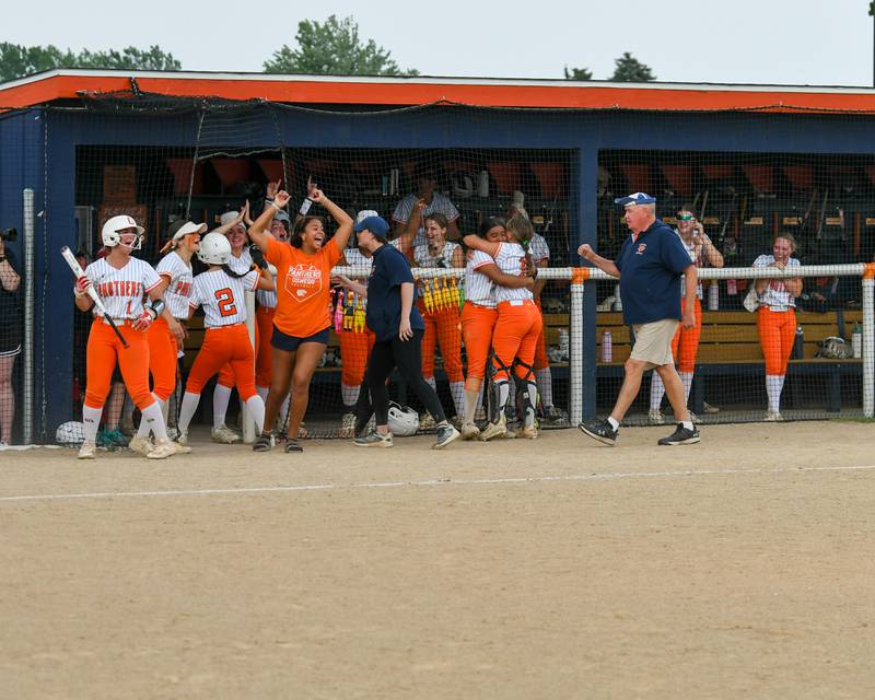 Oswego’s dugout celebrates as two runs score off of the bat of Kennedy Gengler two base hit during the game while taking on Yorkville in the sectional semifinal game held at Oswego High School.