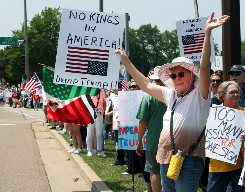 DeKalb Police Chief David Byrd talks to protesters Saturday, June 14, 2025, during a No Kings rally along Sycamore Road at Hopkins Park in DeKalb. The group was protesting the policies of President Donald Trump and his administration.