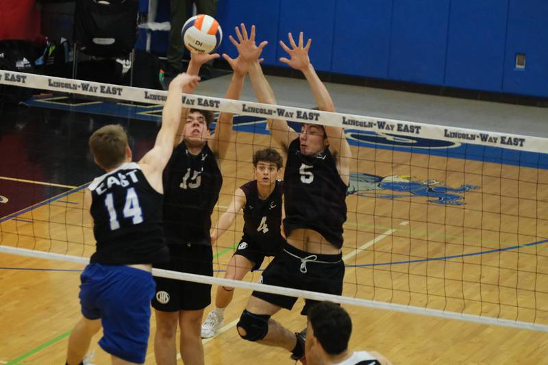 Lockport’s Evan Dziadkowiec (15) and Ben Murdoch (5) go for the block against Lincoln-Way East in the Lincoln-Way East Tournament 3rd place match. Saturday, April 30, 2022, in Frankfort.