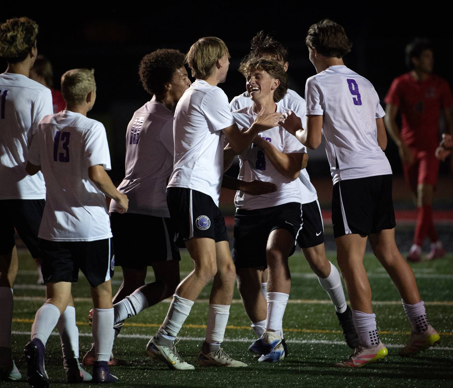 Manteno's Gio Arrigo, center, is congratulated by his teammates after scoring a goal against Bradley-Bourbonnais on Tuesday, September 16, 2025.