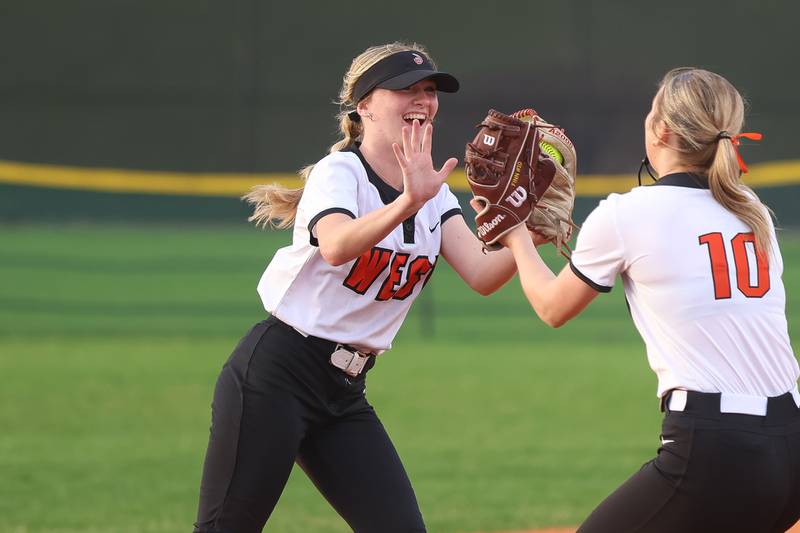 Lincoln-Way West’s Reegan Connolly gets high fives after an acrobatic catch to end the inning against Lockport in the WJOL Softball Tournament championship game on Thursday, April 2, 2026 in Joliet.
