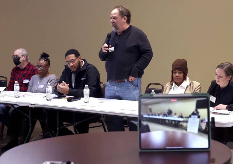 District 428 School Board candidate Jim Mitchell speaks as the event is videoed on an iPad Thursday, March 20, 2025, during the DeKalb Area Rental Association and DeKalb Area Builders Association School Board Candidates Forum at Faranda's Banquets in DeKalb.