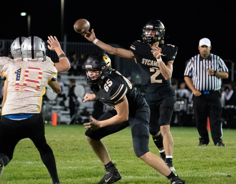 Sycamore's Elijah Meier (2) passes the ball against Kaneland during a football game at Kaneland High School in Maple Park on Friday, Sep 30, 2022.