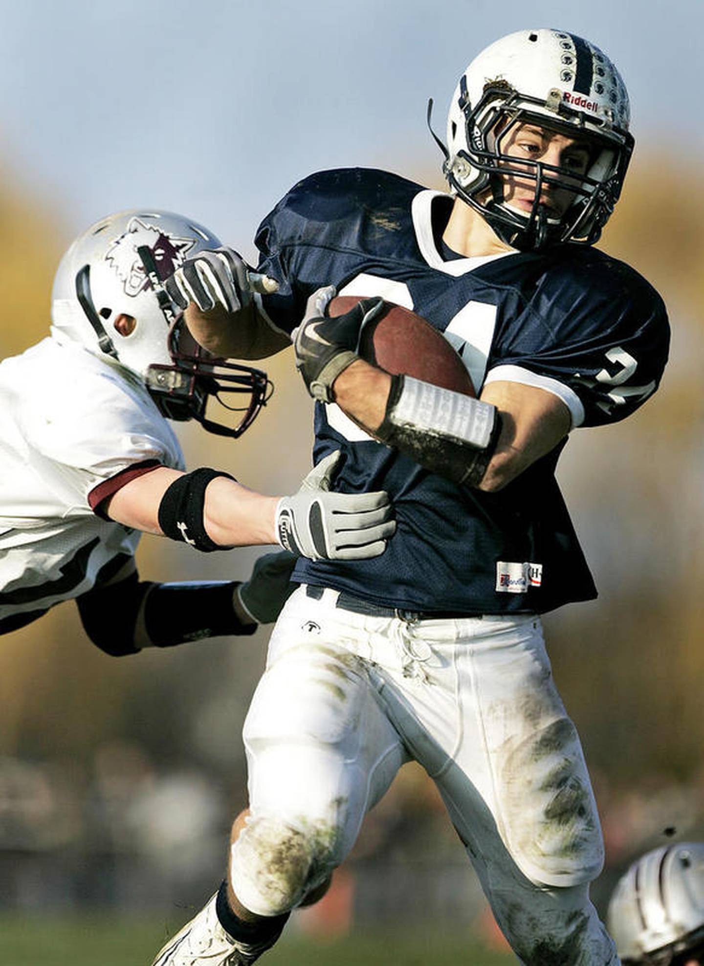 Cary-Grove's Alex Hembrey runs around Prairie Ridge defenders during the second half of the Trojans' 40-7 victory.