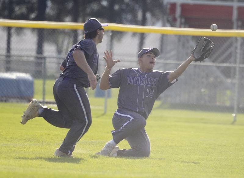 Dixon’s Gage Helfrich slides but is unable to snag a foul ball against Oregon Thursday, April 23, 2026.