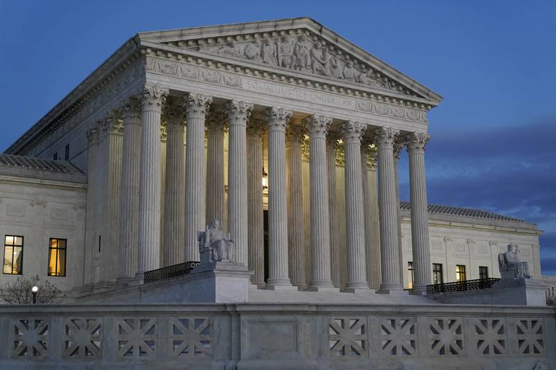 FILE - Light illuminates part of the Supreme Court building at dusk on Capitol Hill in Washington on Nov. 16, 2022. The chairman of the Senate Judiciary Committee said his panel is reviewing “serious allegations” in a report Saturday, Nov. 19, 2022, that a former anti-abortion leader knew in advance the outcome of a 2014 Supreme Court case involving health care coverage of contraception. (AP Photo/Patrick Semansky, File)