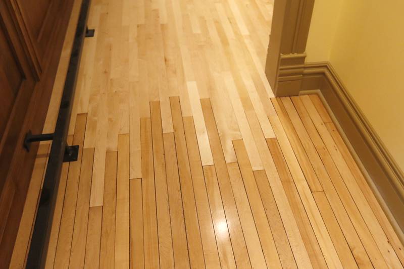 Old and new flooring is blended together in the newly remodeled Old Courthouse Center in Woodstock on Thursday, July 13, 2023, during a tour of the building.