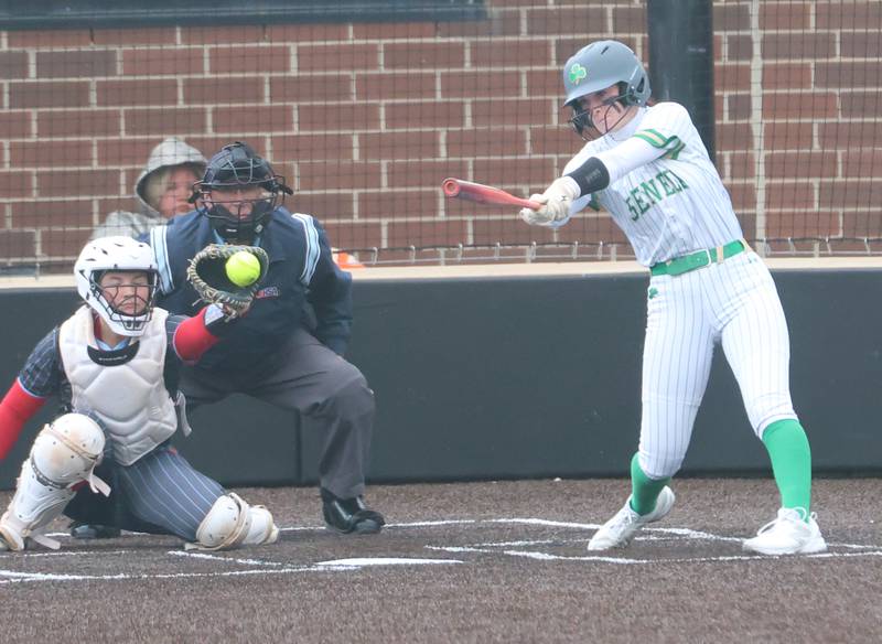 Seneca's Hayden Pfeifer strikes out swinging as Ottawa catcher Bobbi Snok squeezes the glove behind the plate on Friday, May 1, 2026 at Seneca High School.
