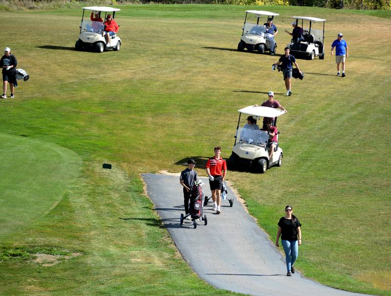 Forreston's Drain Greenfield (center) walks to the green with his foursome during the 1A Pearl City Regional on Wednesday, Oct. 1, 2025 at Wolf Hollow Golf Course in Lena