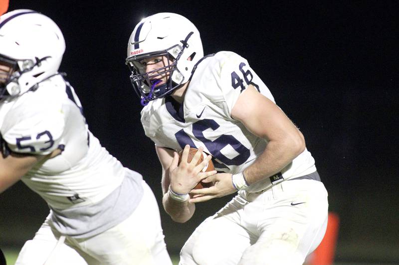 Cary-Grove’s Logan Abrams moves the ball in varsity football at Metcalf Field in Crystal lake Friday night.