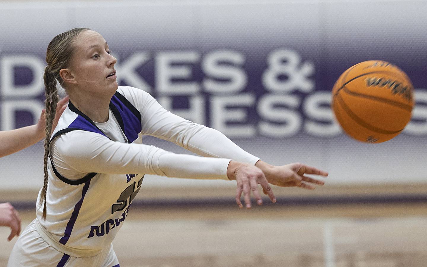 Dixon's Makenzie Toms makes a pass against North Boone Thursday, Dec. 19, 2024, at Dixon High School.