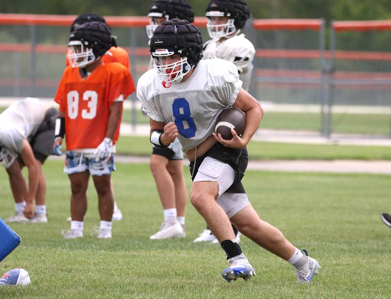 Genoa-Kingston’s Owen Zaccard carries the ball Tuesday, Aug. 19, 2025, during practice at the school.