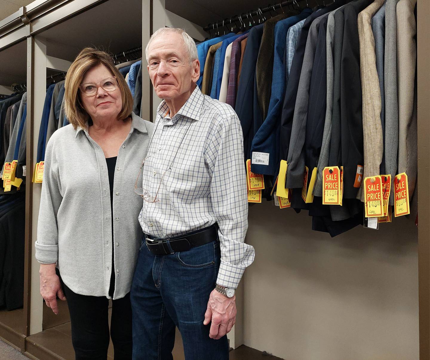 Patrick and Janet Graham pose for a photo Tuesday, March 5, 2024, after announcing I. Bell's Clothing in downtown Ottawa will close after more than 100 years in business.