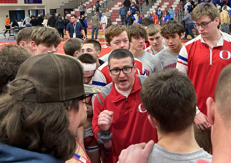 Oregon Coach Justin Lahman talks to his team after the Hawks edged Sterling Newman at the 1A team sectional held Tuesday, Feb. 25, 2025 in the Blackhawk Center in Oregon. The Hawks beat Newman 39-30 to advance to the state team final this weekend.