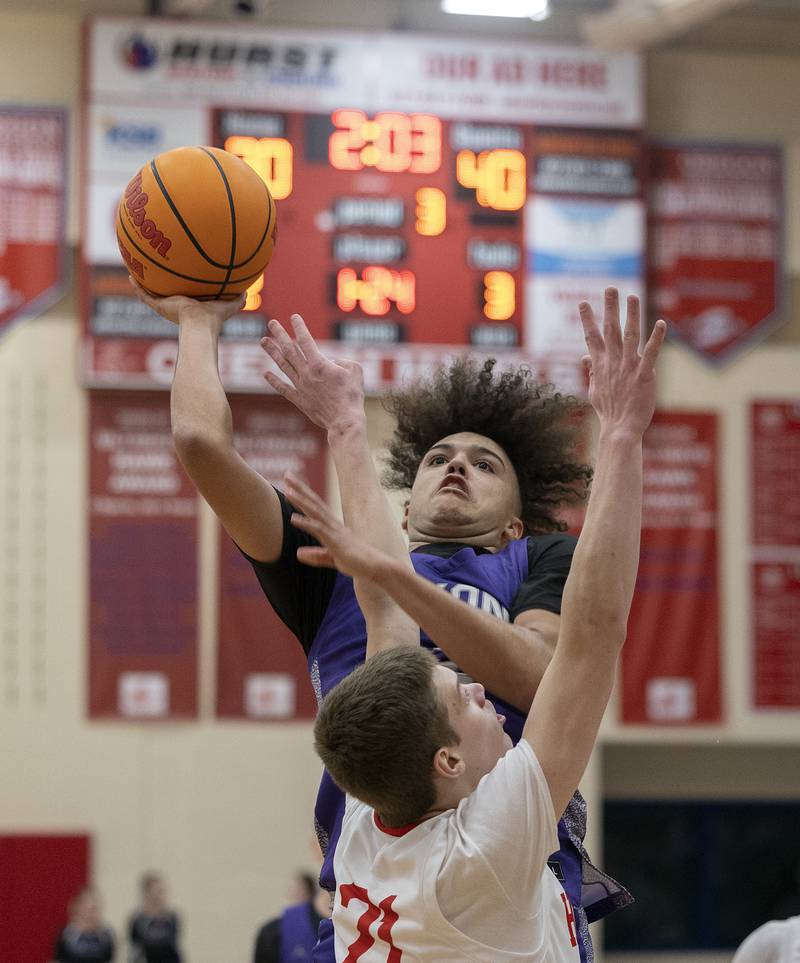 Dixon’s Darius Harrington puts in the basket to break the school scoring record with 1,783 points Tuesday, Feb. 4, 2025, against Oregon.